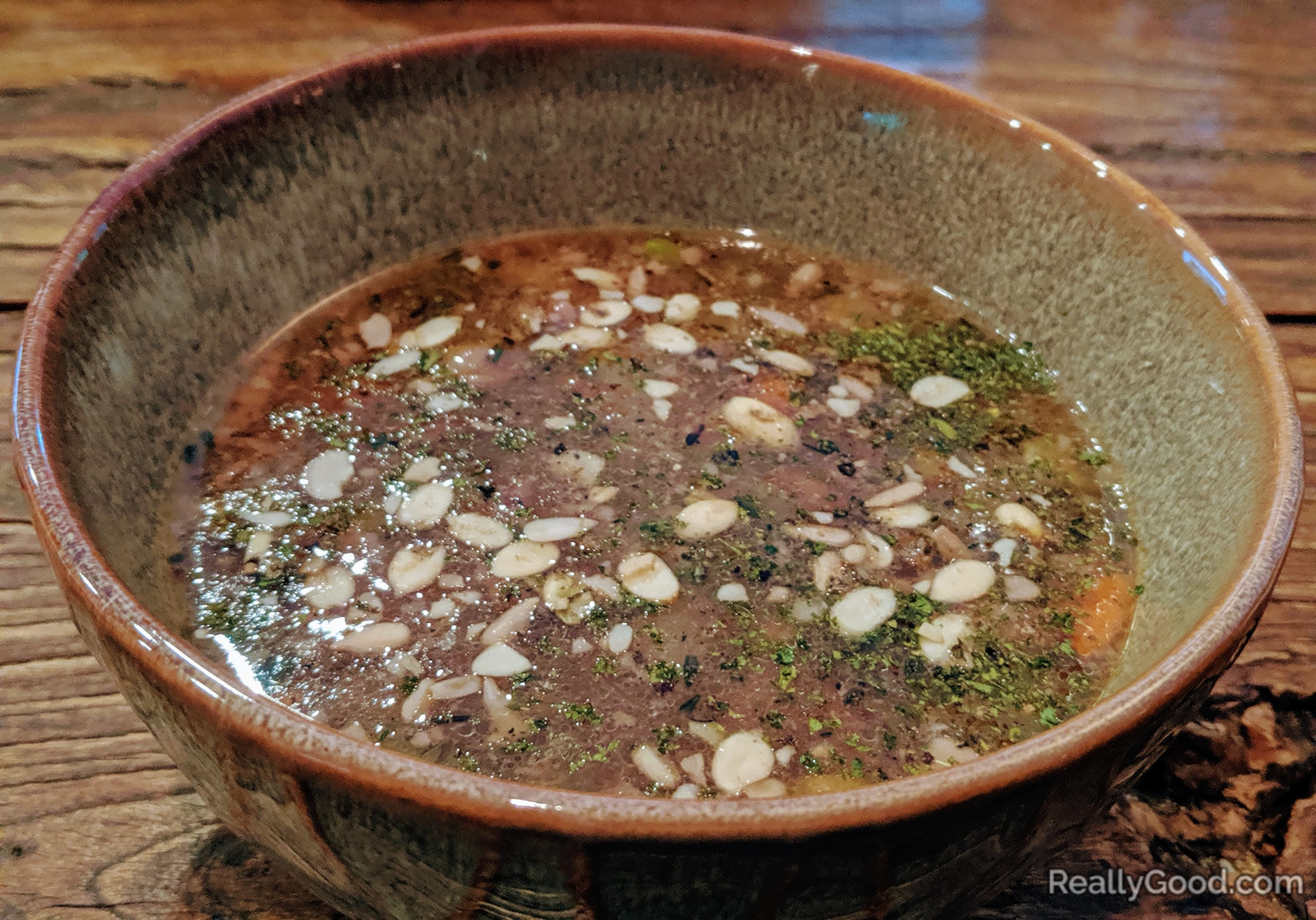 Beef bone broth with veggies and organic sprouted seeds